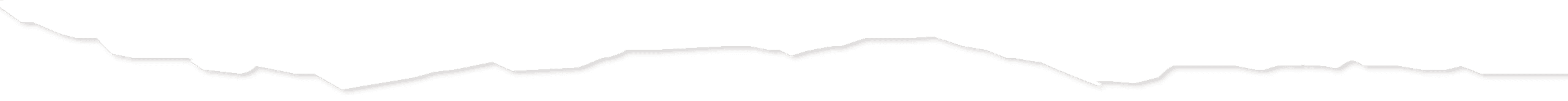 Silhouette of jagged mountain range at night.